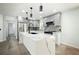 Elegant kitchen features a large center island with marble countertop, sleek appliances, and modern pendant lighting at 681 Fielding Sw Ln, Atlanta, GA 30311