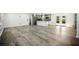Open floor plan with kitchen and living room featuring stainless steel appliances and ample lighting at 681 Fielding Sw Ln, Atlanta, GA 30311