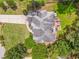 An aerial view of a private backyard with mature trees, a deck, and lush lawn space at 119 Creekside Vw, Hiram, GA 30141