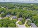 Aerial view of a wooded residential area with well-maintained homes at 119 Creekside Vw, Hiram, GA 30141