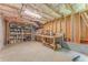 Unfinished basement featuring exposed insulation, a work bench, and shelving at 119 Creekside Vw, Hiram, GA 30141