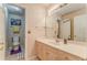 Bathroom featuring a large mirror, ample counter space, and a separate toilet area at 119 Creekside Vw, Hiram, GA 30141
