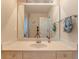 Bathroom featuring a large mirror, light wood vanity, and neutral color scheme at 119 Creekside Vw, Hiram, GA 30141