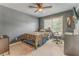 Cozy bedroom with ceiling fan, window and carpet, perfect for sleeping or relaxing after a long day at 119 Creekside Vw, Hiram, GA 30141