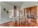 Cozy dining room with hardwood floors and plenty of natural light at 119 Creekside Vw, Hiram, GA 30141