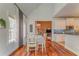 Inviting dining area with stylish light fixture and hardwood floors at 119 Creekside Vw, Hiram, GA 30141