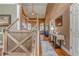 Bright foyer with hardwood floors, tall ceilings, staircase, decor, and a view of the living area at 119 Creekside Vw, Hiram, GA 30141