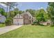 Beautiful two-story home with manicured lawn, two-car garage, and stone accents at 119 Creekside Vw, Hiram, GA 30141