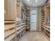 Spacious walk-in closet with custom shelves, drawers, and ample storage for clothes, shoes and accessories at 119 Creekside Vw, Hiram, GA 30141