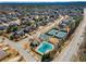 A beautiful aerial view of a community with a pool, tennis courts and manicured lawns at 2564 Lulworth Ne Ln, Marietta, GA 30062