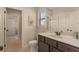 Neutral bathroom featuring a single sink vanity and a walk-in shower in the background at 2564 Lulworth Ne Ln, Marietta, GA 30062