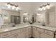 Bathroom with double sinks, granite countertops, and an adjacent walk-in shower at 2564 Lulworth Ne Ln, Marietta, GA 30062