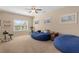 Spacious bedroom featuring cozy beanbag chairs, carpet, and multiple windows for lots of light at 2564 Lulworth Ne Ln, Marietta, GA 30062