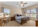 Bright bedroom featuring a ceiling fan and plenty of natural light from the surrounding windows at 2564 Lulworth Ne Ln, Marietta, GA 30062