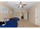 Neutral bedroom featuring a large beanbag chair and an adjoining bathroom and closet area at 2564 Lulworth Ne Ln, Marietta, GA 30062
