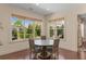 Charming dining area with large windows offering views of the well-manicured backyard at 2564 Lulworth Ne Ln, Marietta, GA 30062