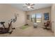 Bright exercise room featuring a stationary bike, weights, and plenty of floor space at 2564 Lulworth Ne Ln, Marietta, GA 30062