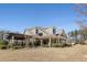 Community center exterior has a pergola, covered patio, and mature landscaping at 2564 Lulworth Ne Ln, Marietta, GA 30062