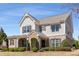 Beautiful two-story home with a stone-accented entrance, gray siding, and well-maintained landscaping at 2564 Lulworth Ne Ln, Marietta, GA 30062
