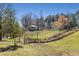 Community green space features a pedestrian bridge and a gazebo on a hill at 2564 Lulworth Ne Ln, Marietta, GA 30062