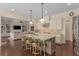 Spacious kitchen with seating island flows into the living room, perfect for entertaining at 2564 Lulworth Ne Ln, Marietta, GA 30062