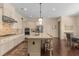 Bright kitchen with a center island, stainless steel appliances, and white cabinets at 2564 Lulworth Ne Ln, Marietta, GA 30062