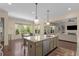 Open concept kitchen with center island and eat-in area, filled with natural light at 2564 Lulworth Ne Ln, Marietta, GA 30062