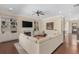 Spacious living room with built-in shelving, fireplace, and a large sectional sofa at 2564 Lulworth Ne Ln, Marietta, GA 30062