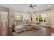 Open-concept living room with a view into the kitchen, hardwood floors, and neutral decor at 2564 Lulworth Ne Ln, Marietta, GA 30062