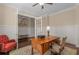 Inviting home office with hardwood floors, wainscoting, and a classic wooden desk and chair at 2564 Lulworth Ne Ln, Marietta, GA 30062