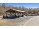 A shady picnic area with tables and grills for outdoor dining and gatherings at 2564 Lulworth Ne Ln, Marietta, GA 30062