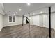 Finished basement featuring recessed lighting, painted columns, and wood-look flooring at 3524 Brookfield Ln, Decatur, GA 30032
