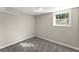 Bedroom featuring gray carpet, one window, neutral walls, and white trim at 3524 Brookfield Ln, Decatur, GA 30032