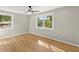 Spacious bedroom with hardwood floors, neutral walls, and bright windows at 3524 Brookfield Ln, Decatur, GA 30032