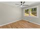 Bedroom featuring a ceiling fan, wood floors, and natural light at 3524 Brookfield Ln, Decatur, GA 30032