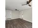 Spacious bedroom featuring wood-look floors, two ceiling fans, and neutral paint at 3524 Brookfield Ln, Decatur, GA 30032