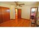 Bedroom view of adjacent hallway and full pink tiled bathroom at 3528 Highway 42 S, Locust Grove, GA 30248