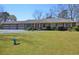Charming single-story home with a brick facade, well-maintained lawn, and a spacious four-car garage at 3528 Highway 42 S, Locust Grove, GA 30248