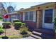 Attractive brick home featuring a well-manicured garden and a convenient four-car garage at 3528 Highway 42 S, Locust Grove, GA 30248