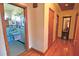 Hallway view of full blue tiled bathroom with blue sink and flooring at 3528 Highway 42 S, Locust Grove, GA 30248