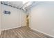 Finished basement with light gray walls and wood-look flooring at 1019 Walnut Creek Dr, Woodstock, GA 30188