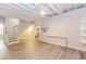 Finished basement with plank flooring, white walls, and ample space for flexible use at 1019 Walnut Creek Dr, Woodstock, GA 30188