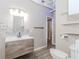 Basement bathroom featuring a modern vanity, tiled backsplash, updated fixtures, and a toilet at 1019 Walnut Creek Dr, Woodstock, GA 30188