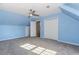 Upstairs blue bedroom has a ceiling fan and closet at 1019 Walnut Creek Dr, Woodstock, GA 30188