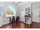 Bright breakfast nook featuring large arched windows, hardwood floors, and a modern dining set at 1019 Walnut Creek Dr, Woodstock, GA 30188