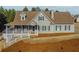 Charming home featuring a well-maintained lawn, cozy front porch, and classic architectural details at 1019 Walnut Creek Dr, Woodstock, GA 30188