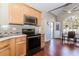Modern kitchen with sleek appliances, bright lighting, and an adjacent breakfast area with scenic views at 1019 Walnut Creek Dr, Woodstock, GA 30188