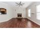 Spacious living room with hardwood floors, fireplace and large windows that provide lots of natural light at 1019 Walnut Creek Dr, Woodstock, GA 30188