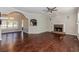 Spacious open-concept living area with fireplace, hardwood floors, and seamless flow to the dining area at 1019 Walnut Creek Dr, Woodstock, GA 30188