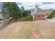 Expansive backyard with mature trees, partial fence, and lush greenery at 103 Gold Springs Ct, Canton, GA 30114